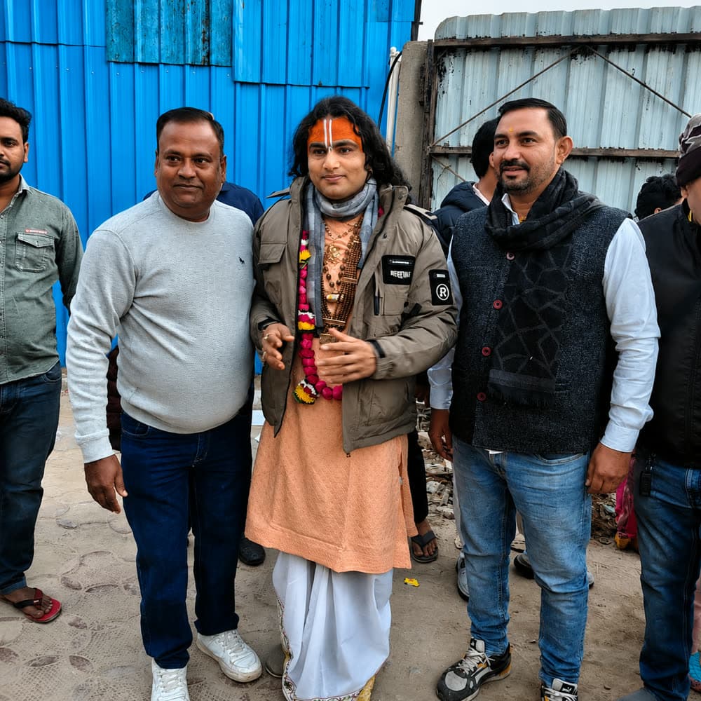 A sadhu with pilgrims during a Braj yatra